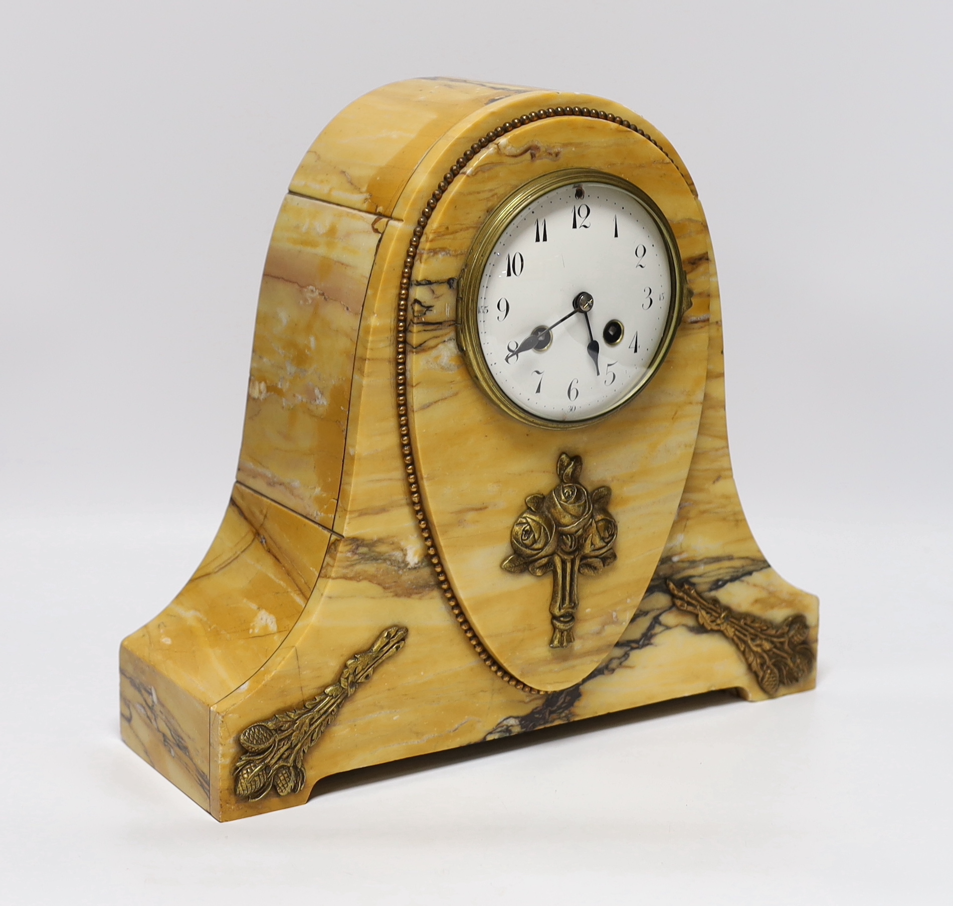 An early 20th century French Sienna marble clock garniture, 30cm